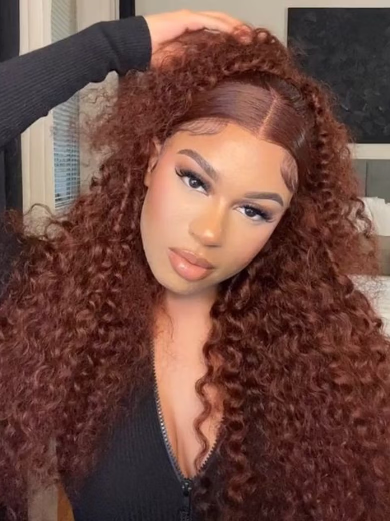The UNice 180% Density Reddish Brown Water Wave Or Honey Blonde Jerry Curly 13x4 wig visual image position 2 shows a model with long curly hair wearing a black sweater |.