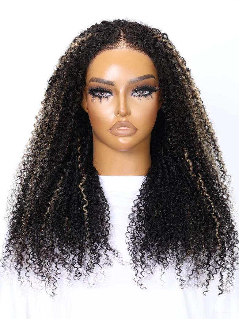 A model displays the UNice 22''=119 Bye Bye Knots Wig 7x5 Glueless Lace Black With Blonde Highlights, showing a model wearing a long curly wig and kinky curly texture.
