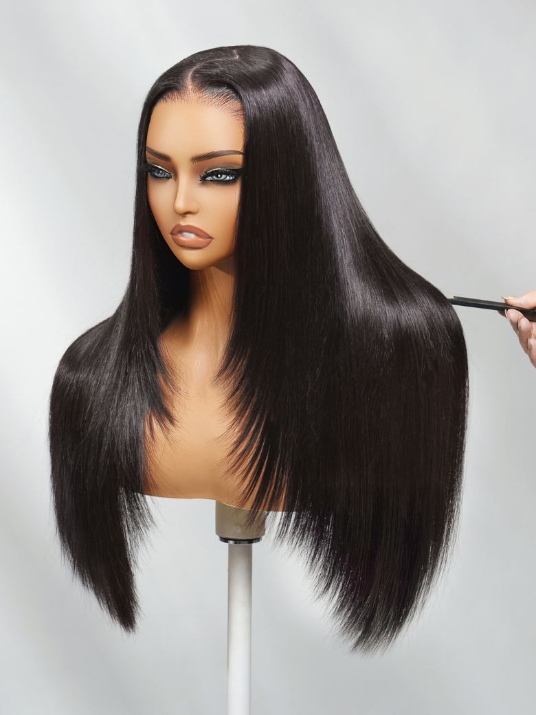 A model displays the UNice Pre-Everything Lace Frontal Black Feather Layer Cut Straight Glueless Invisi, showing a model is brushing her hair with a brush and straight.