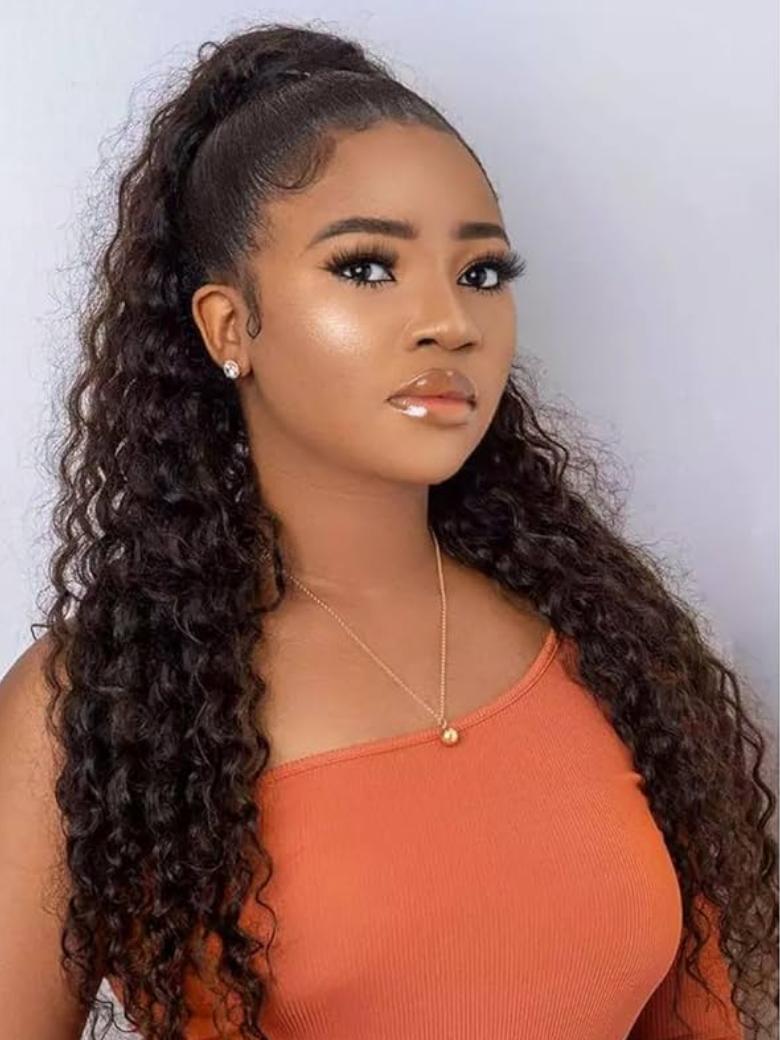 A model displays the UNice Machine-Made Dark Brown Deep Wave Clip-In Ponytail Extension, showing a model with long curly hair wearing a red top and deep wave texture.
