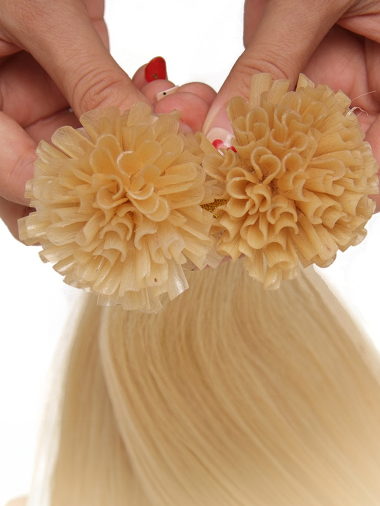 A model displays the UNice KERAHERO U-TIP STRAIGHT: 50G, showing a model is holding two large flowers in her hair and straight texture.