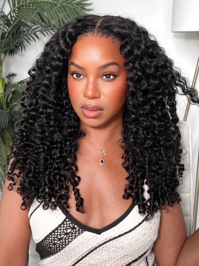 A model displays the UNice Ship within 24H UNice Bye Bye Knots 7x5 Lace Pre-Everything Curly Texture wig, showing a model with long curly hair wearing a white top.