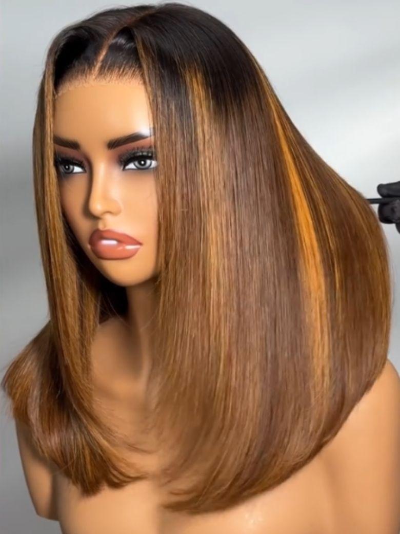 A model displays the UNice Bye Bye Knots 7x5 Lace Brown With Blonde Piano Highlights Blunt Bob Wig with, showing a wig with a long, straight, straight hair.