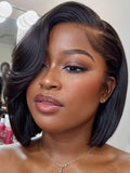 The UNice Bye Bye Slip 7x5 Lace Side Part Layered Wig With Side-Swept Bangs with visual image position 2 shows a model with short hair and a necklace | 7x5, lace finish.