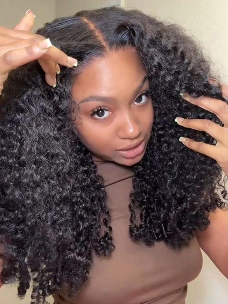 A model displays the UNice Mixed Texture Lace Natural Black Jerry Curly Wig with Defined Finger Coil Ends, showing a model with long curly hair and a brown shirt.