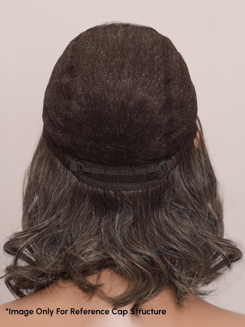 A model displays the UNice SLOANNE- 12" MONO & SWISS LACE BODY WAVE HUMAN HAIR WIG, showing a model with long hair wearing a black hat and body wave texture, lace finish.