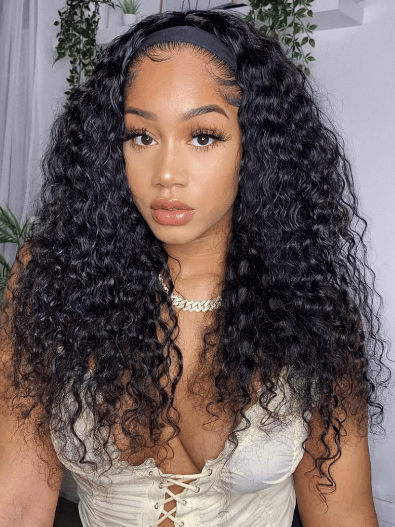 The UNice Put On And Go Water Wave Human Hair Headband Glueless Wig visual image position 2 shows a model with long curly hair wearing a white top | water wave texture.