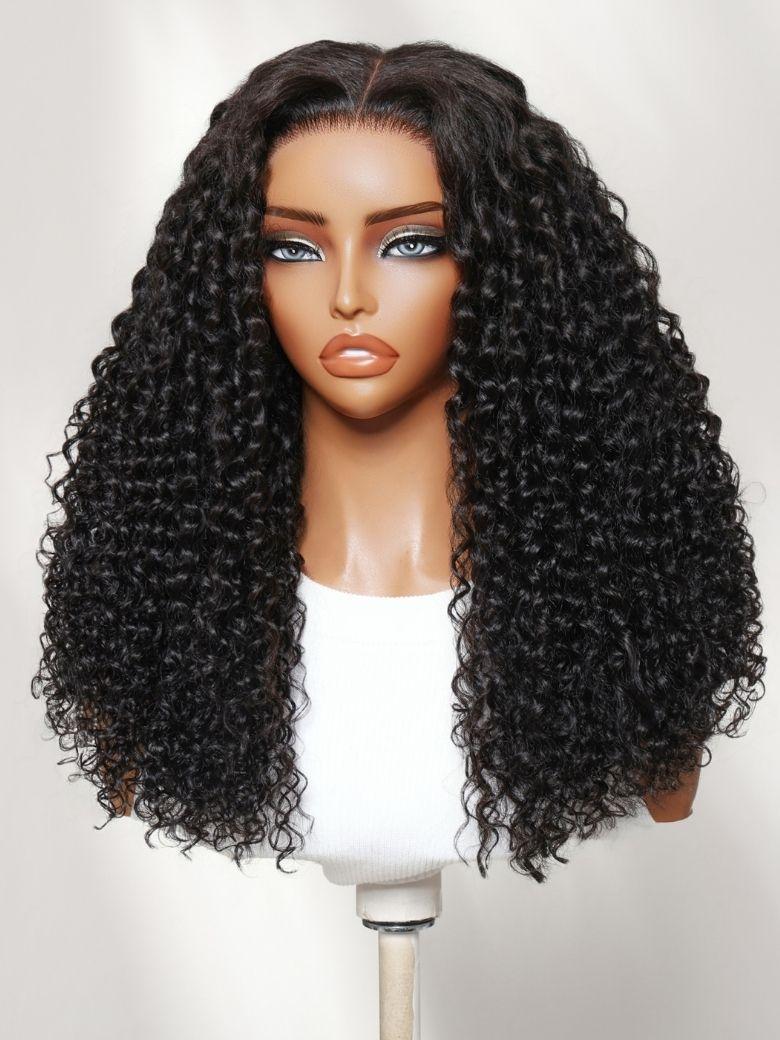 A model displays the UNice 13x4 Bye Bye Slip Lace Frontal Soft Water Wave Glueless Wig with Fluffy Loose, showing a woman holding a coconut and a drink and water wave.