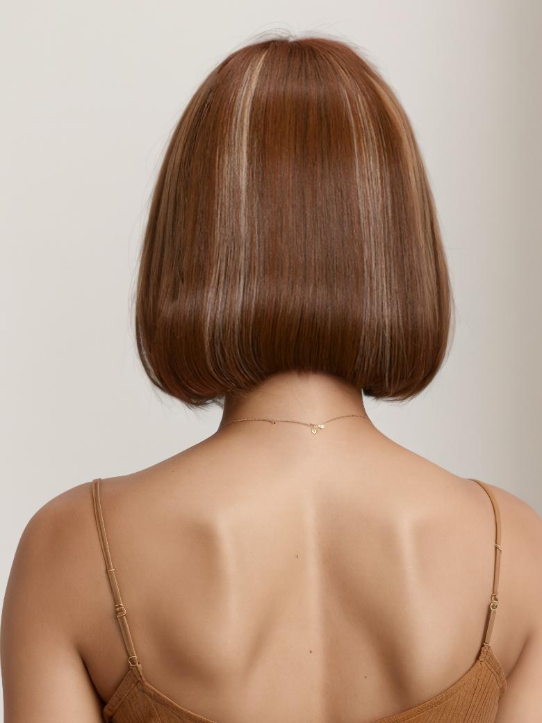 A model displays the UNice AMARA -12" MONO STRAIGHT HUMAN HAIR WIG, showing a model with a brown hair and straight texture.
