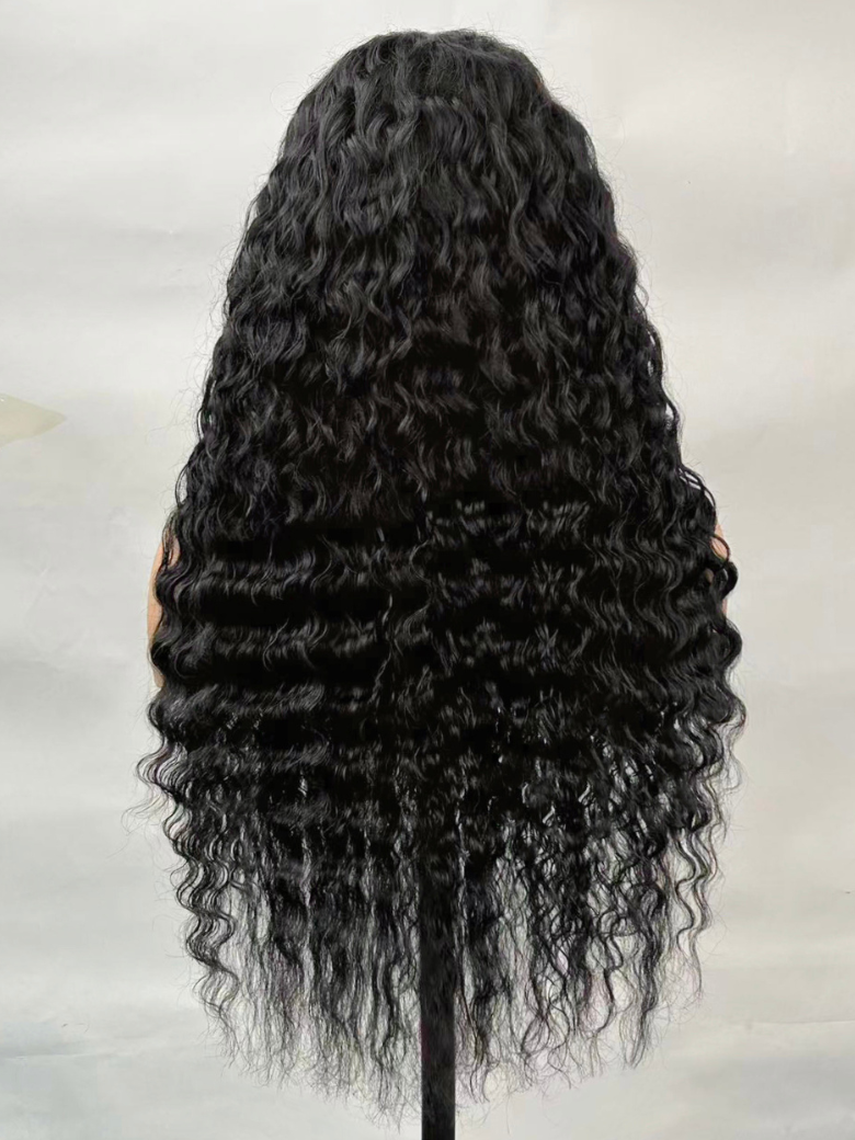 A model displays the UNice 13x4 Bye Bye Slip Lace Frontal Soft Water Wave Glueless Wig with Fluffy Loose, showing a model with long black curly hair and water wave.