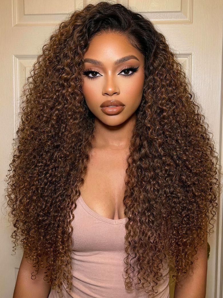A model displays the UNice 7x5 Bye Bye Slip Lace Warm Caramel Brown with Dark Roots Natural Afro Curly wig, showing a model with long curly hair wearing a pink tank top.