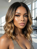 A model displays the UNice 13x4 Pre-Everything Lace Frontal Brown With Honey Blonde Face-Framing, showing a model with long wavy hair and a brown bra bra bra bra bra bra.