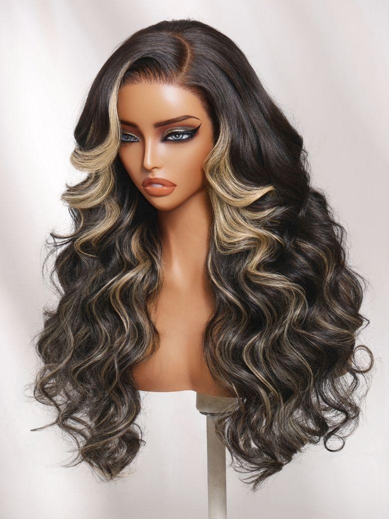 A model displays the UNice 7x5 Bye Bye Slip Lace Black With Blonde Face-Framing Highlights Body Wave Wig, showing a wig with long wavy hair and a blonde wig and body.