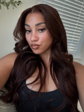 A model displays the UNice Glueless Auburn/Red Brown 13x4 Pre-Everything & 7x5 Lace Wig Loose Wave, showing a model with long brown hair and a black top and loose wave.