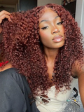 The UNice 6x4.5 Pre Cut Transparent Lace Bleached Knots Put On And Go Reddish Brown wig visual image position 2 shows a model with long curly hair in a salon | kinky.