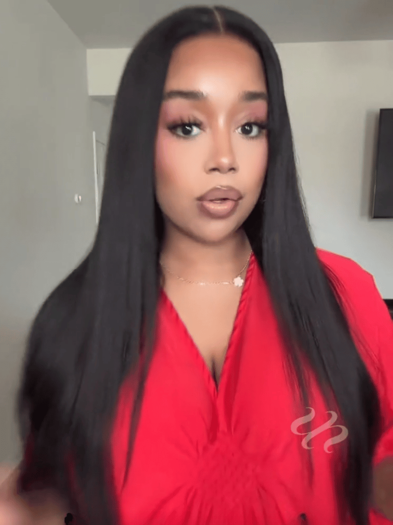 A model displays the UNice 7x5 Bye Bye Slip Yaki Straight Black Glueless Wig With Invisible Drawstring, showing a model with long black hair wearing a red shirt.