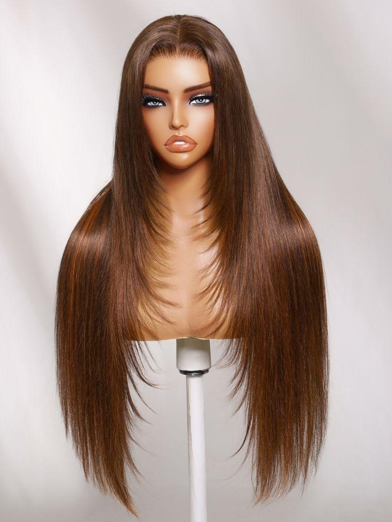 A model displays the UNice 7x5 Bye Bye Slip Lace Rich Brown with Golden Copper Highlights Layered wig, showing a wig with long brown hair and straight texture.