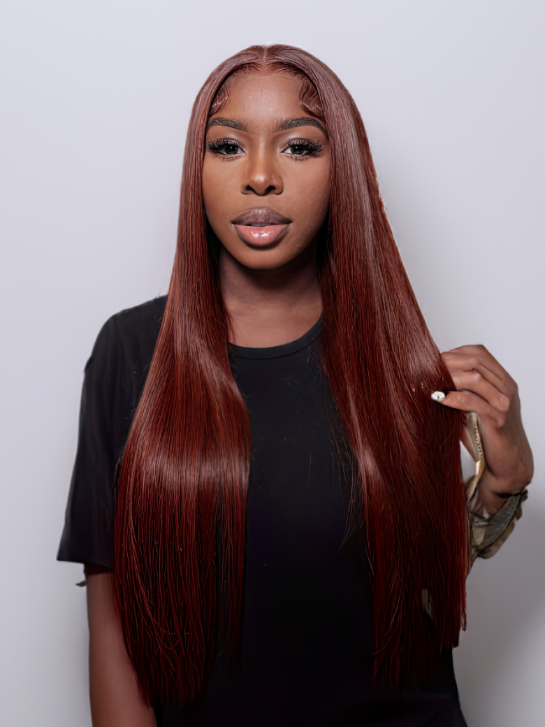 A model displays the UNice Dark Auburn Straight Remy Human Hair 3 Bundles With Closure Deal, showing a model with long red hair and straight texture, bundle fullness.