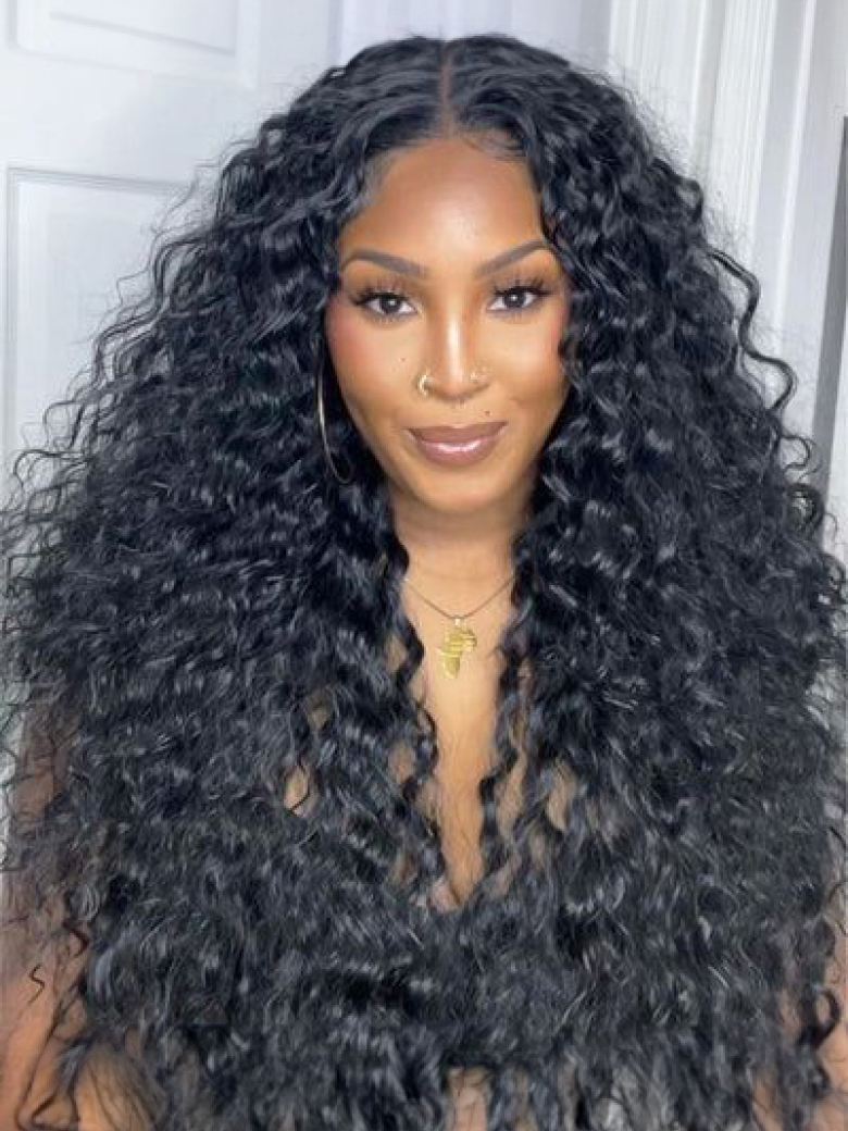 A model displays the UNice Middle Part Lace Kinky Curly wig 150% Density Natural Hairline Glueless wig, showing a model with long curly hair wearing a black dress.