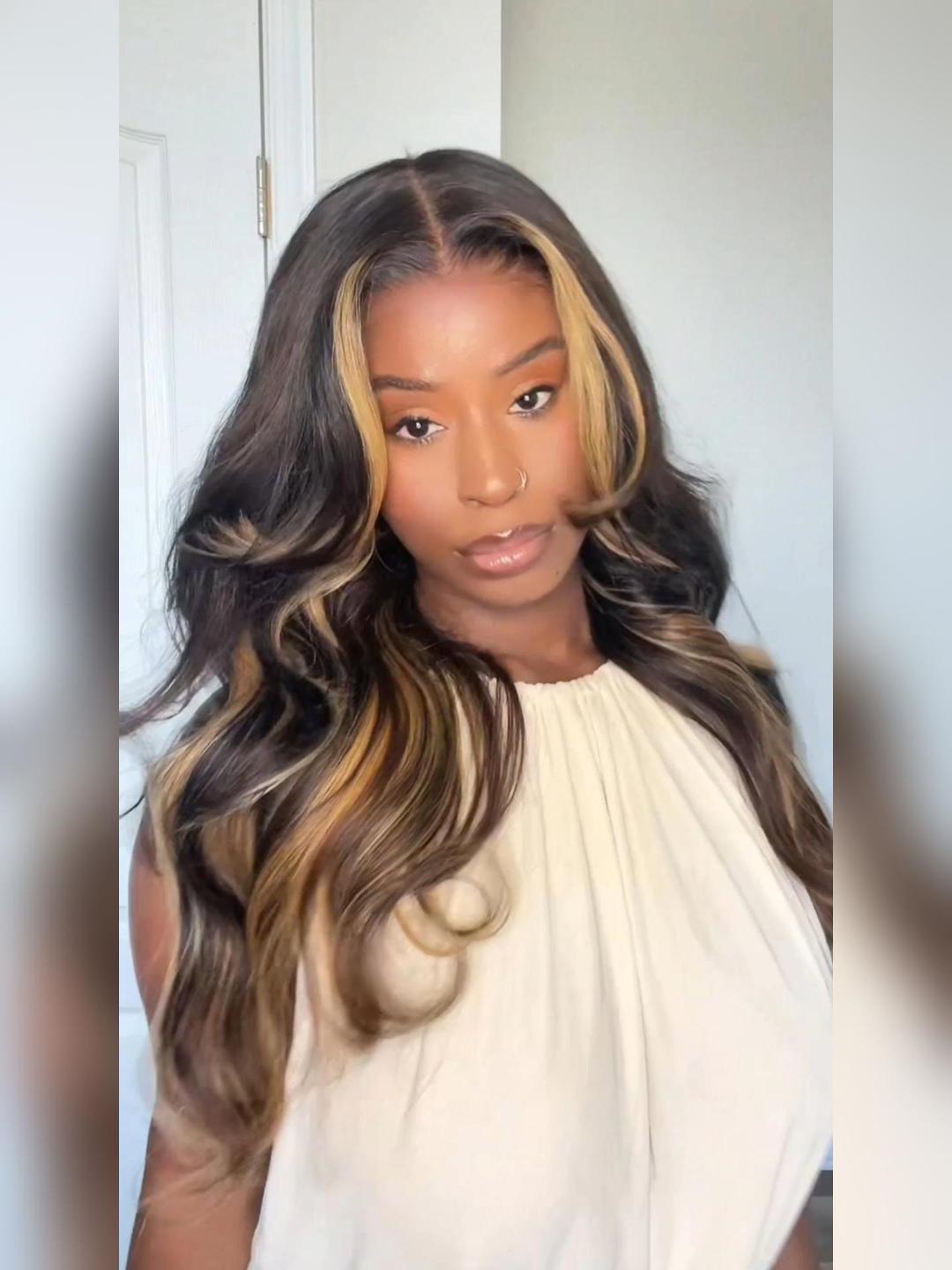 A model displays the UNice 7x5 Bye Bye Slip Lace Loose Wave Butterscotch Highlights Brown with Free Face wig, showing a model with long hair wearing a white top.