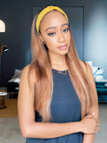 A model displays the UNice Ombre Dark Roots Honey Blonde Human Hair Wig 150% Density Headband Straight, showing a model with long hair wearing a headband and straight.
