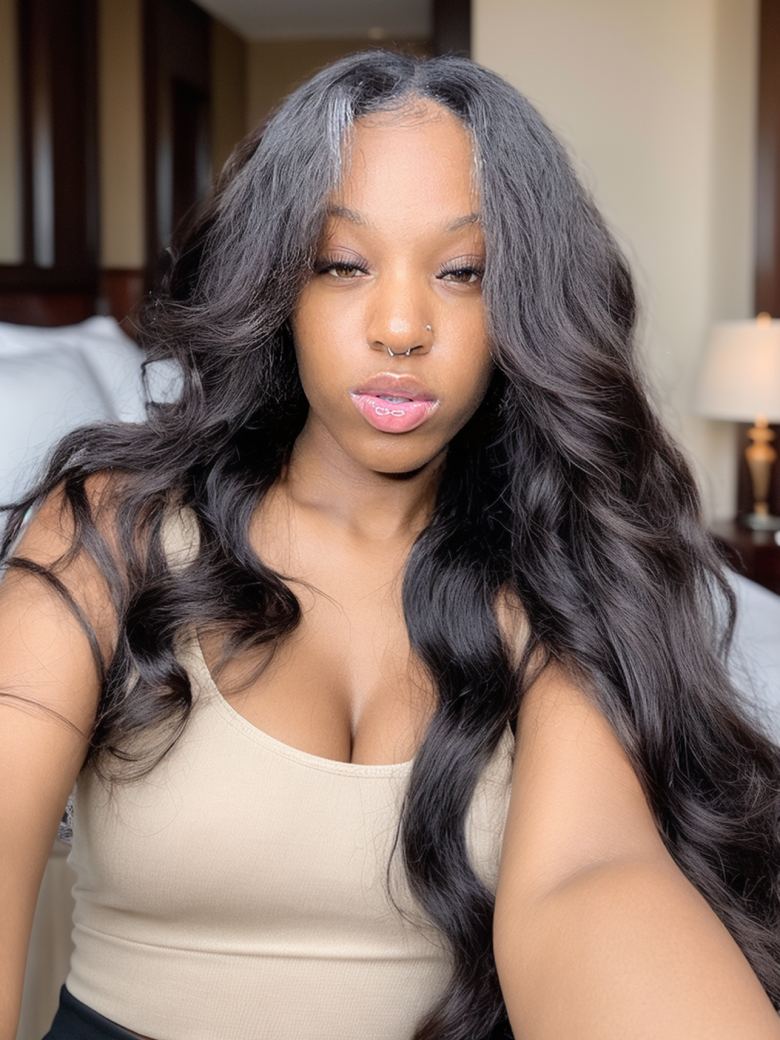 A model displays the UNice Body Wave Beginner Friendly V Part Wig 30 Seconds Quick Install Natural Black, showing a model with long hair sitting on a bed and body wave.
