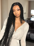 A model displays the UNice Hair 4 Bundles Kinky Curly Unprocessed Virgin Hair, showing a model with long black hair wearing a white sweater and kinky curly texture.