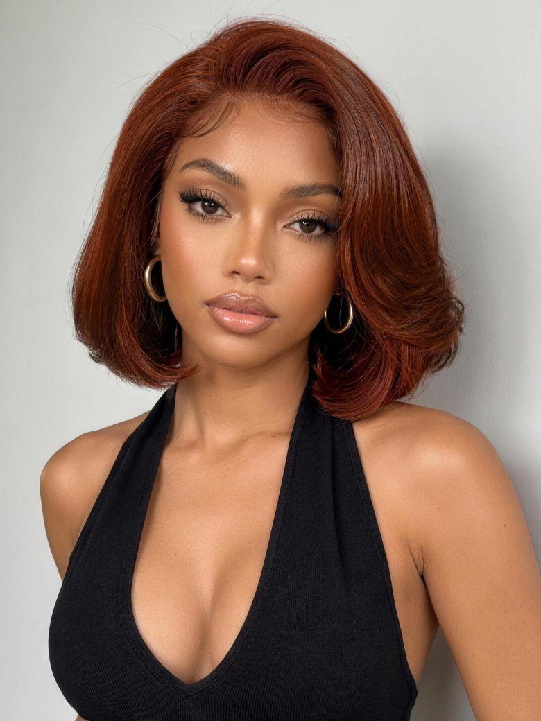 A model displays the UNice 7x5 Bye Bye Slip Lace Copper Auburn Side Part Blowout Bob Glueless Wig with, showing a model with red hair wearing a black halt top and 7x5.