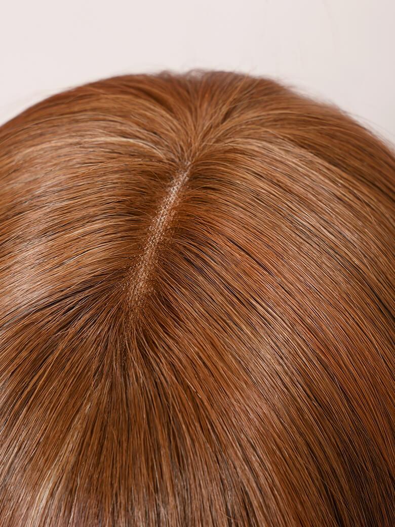A model displays the UNice AMARA -12" MONO STRAIGHT HUMAN HAIR WIG, showing a model with long brown hair and straight texture.