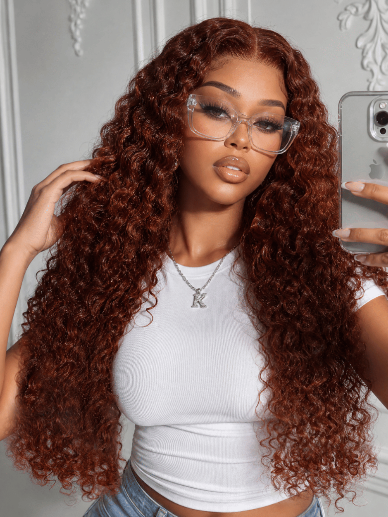 A model displays the UNice 13x4 Bye Bye Slip Lace Frontal Reddish Brown Fluffy Burmese Wavy Human Hair, showing a model with long curly hair and glasses and reddish.