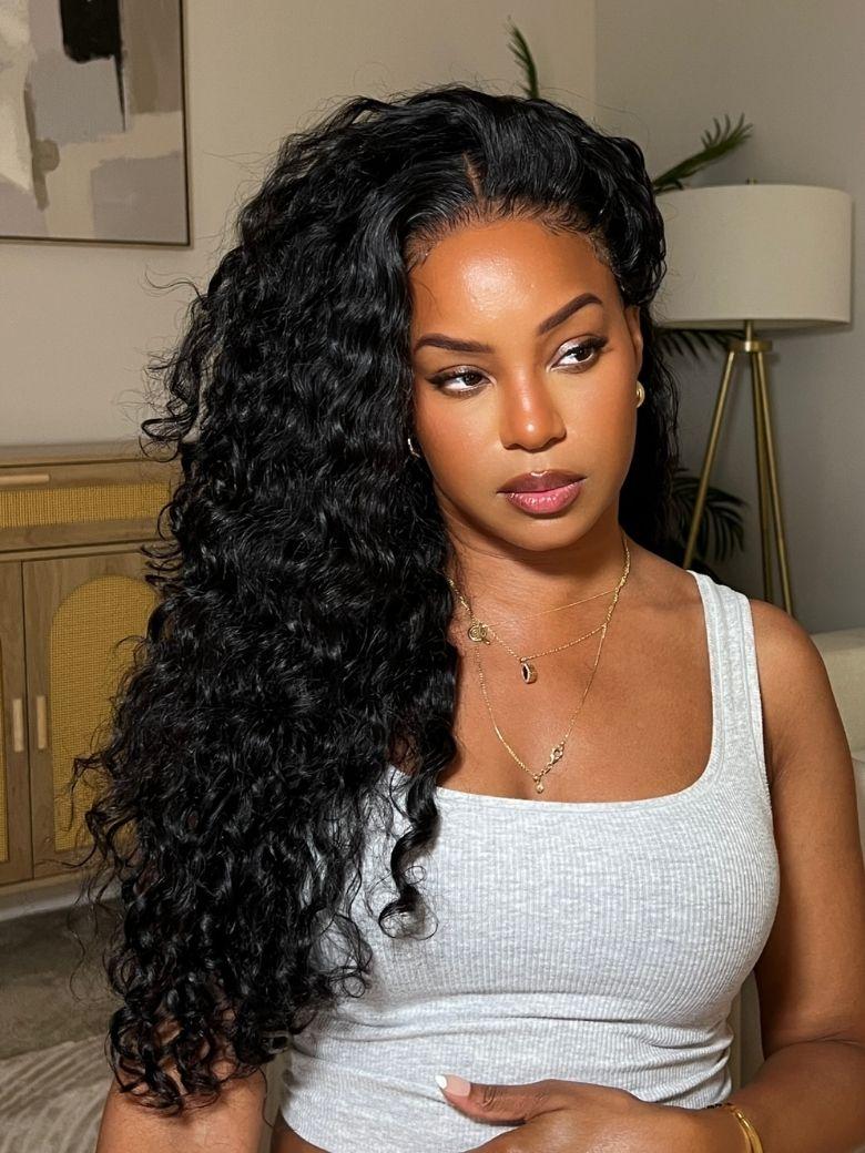 A model displays the UNice 7x5 Bye Bye Knots Lace Glueless Water Wave Grip Wig With Secure Silicone, showing a model with long curly hair wearing a white tank top.