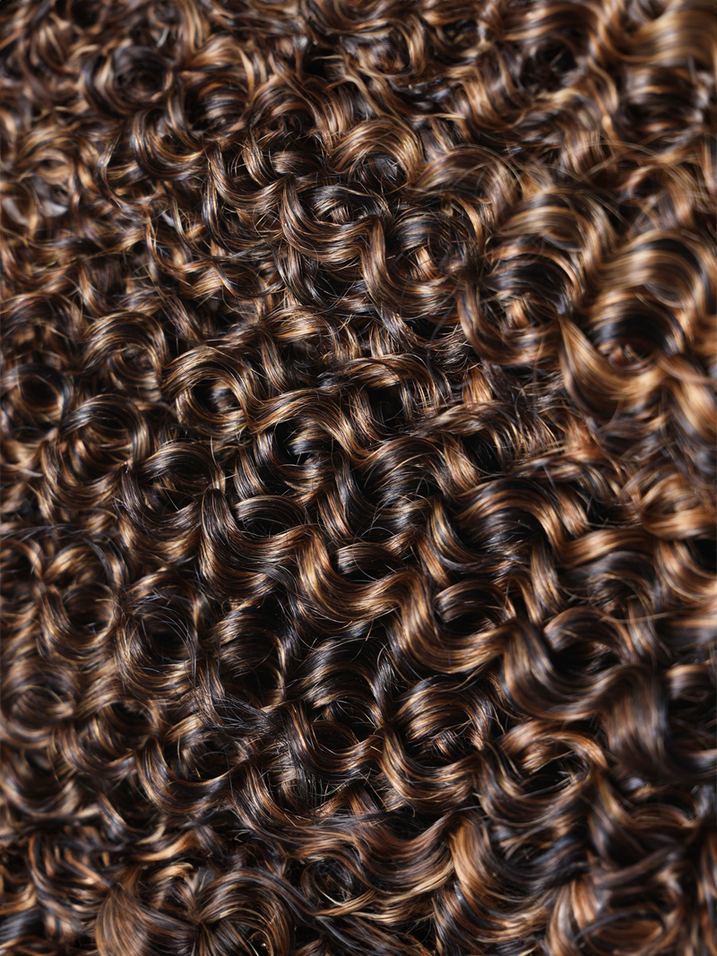 The UNice #FB30 Brown Balayage Highlight 3Pcs Jerry Curly Human Hair Bundles product image shows a close up of a hair salon with lots of curly hair and jerry curl.