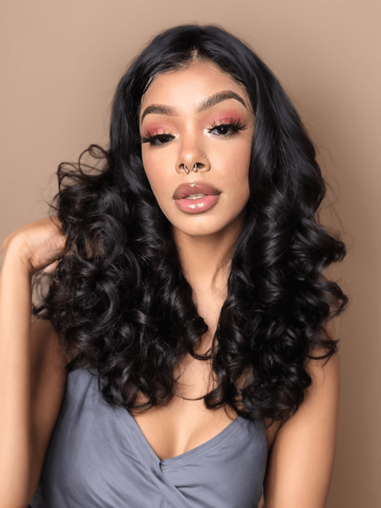A model displays the UNice Hair Loose Wave Hair Extensions Unprocessed Human Virgin Hair, showing a model with long black hair and a pink eye makeup and loose wave.