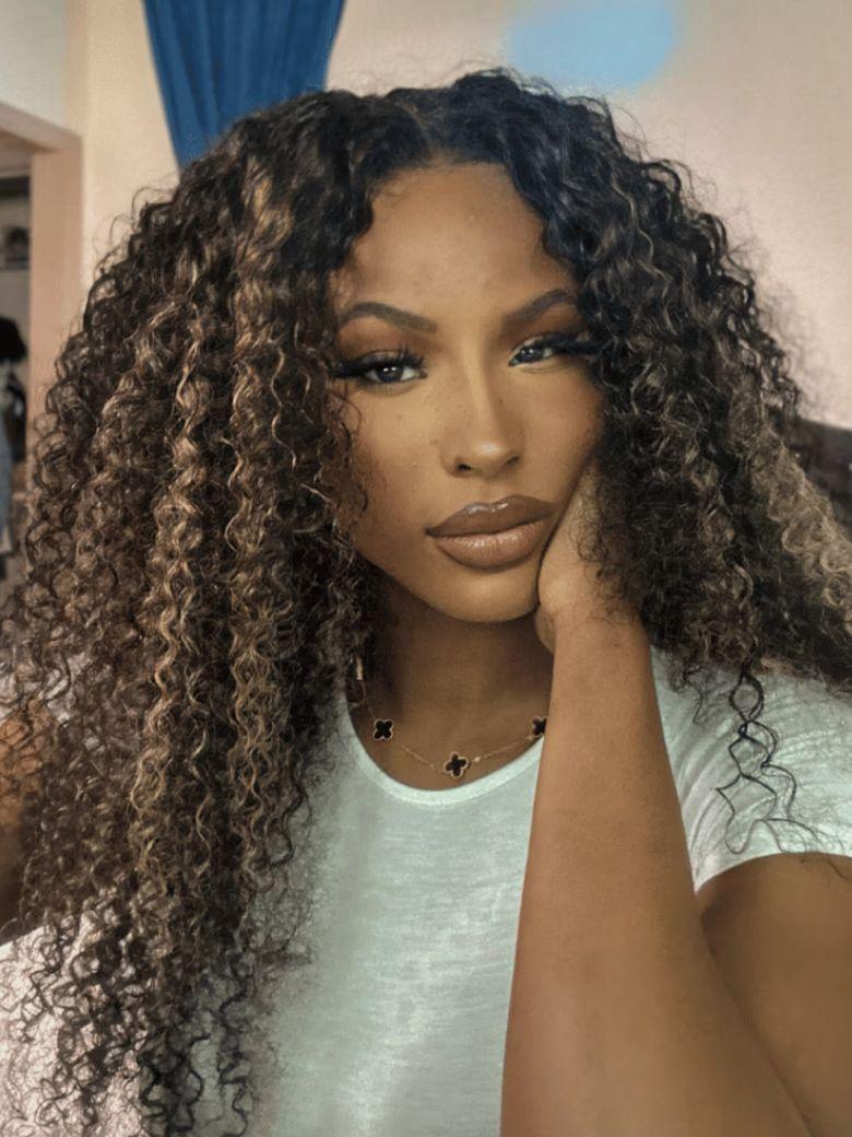 The UNICE $129 Surprise Box Win 13x4 Lace 200% Density Wig Value $299-$399 visual image position 7 shows a model with long curly hair and a white shirt | 13x4, lace.