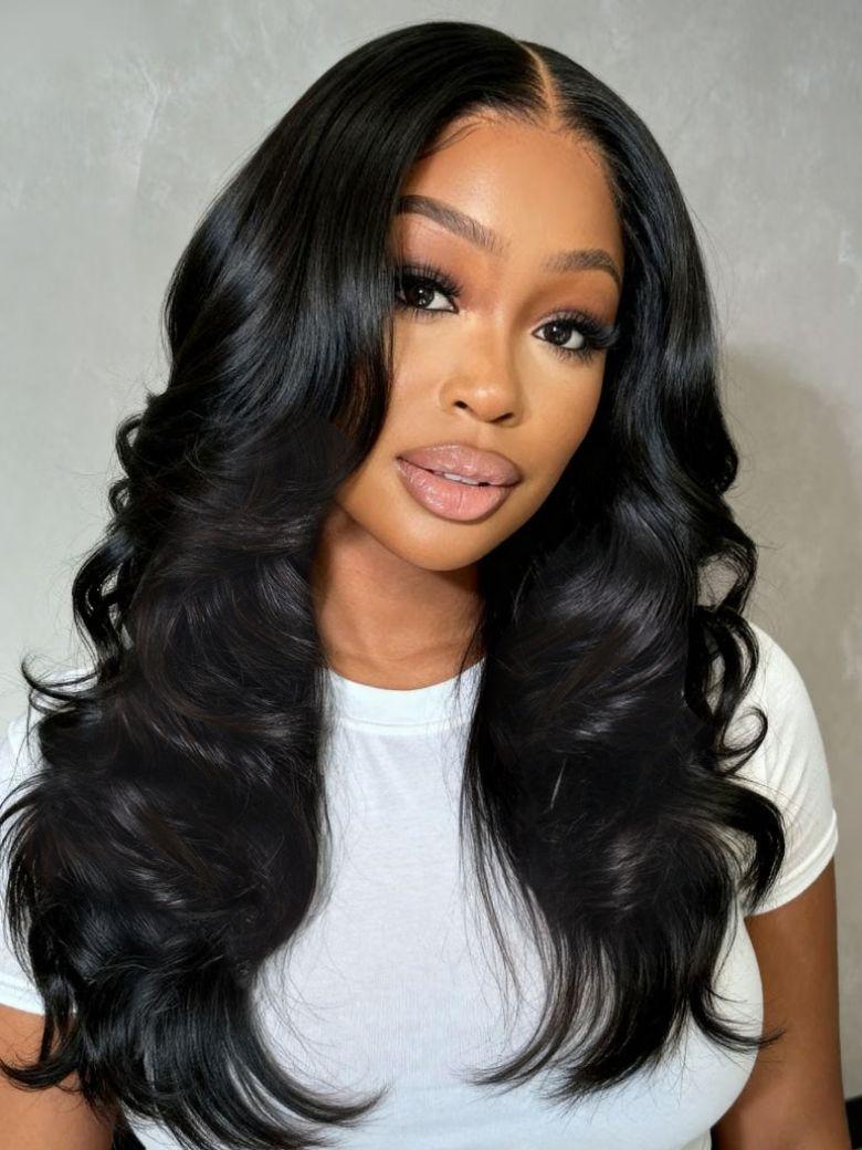 A model displays the UNice 180% Density 7x5 Bye Bye Knots Butterfly Cut Body Curls Lace Wig with, showing a model with long black hair wearing a white shirt and body.