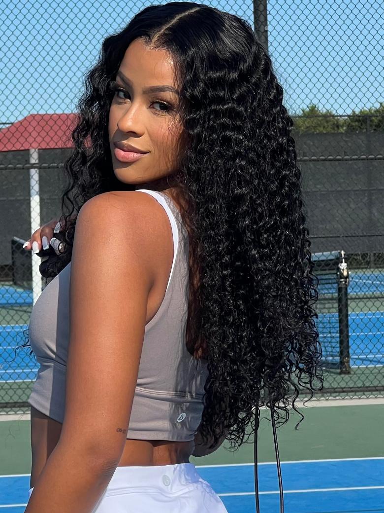 A model displays the UNice Limited Time 7x5 Drawstring Bye Bye Knots Wig Quick Glueless Wet & Wavy Water, showing a woman holding a tennis racket on a tennis court.