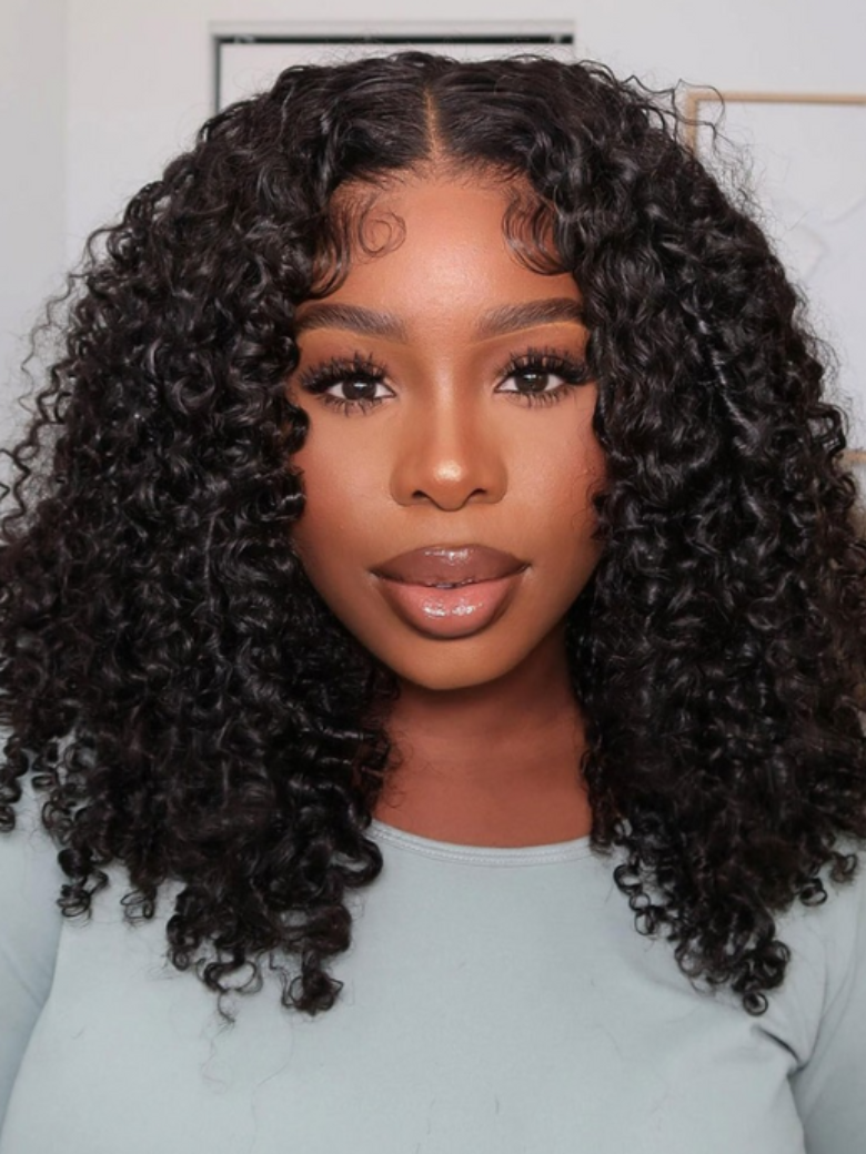 A model displays the UNice Limited Time UNice Maxreal Half Wig 2x4 Lace Part Black Kinky Curly Wig, showing a model with long curly hair wearing a blue top and kinky.