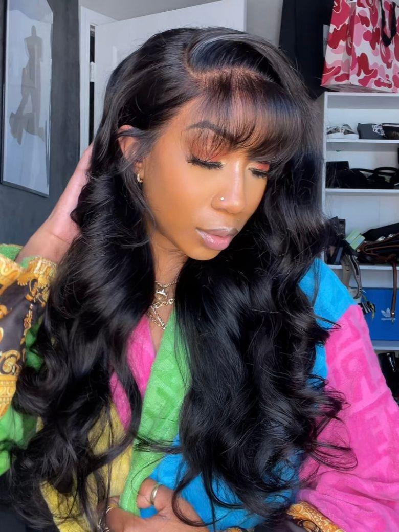 A model displays the UNice Stylish Choice UNice 13x4 Pre-Everything Side-Part Fluffy Loose Wave Wig With, showing a model with long black hair wearing a colorful shirt.