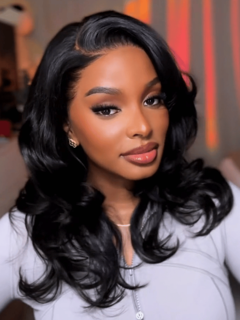 A model displays the UNice 13x4 Pre-Everything Wig With Face-Framing Layers And Side-Swept Bangs With, showing a model with long black hair and a white shirt and 13x4.