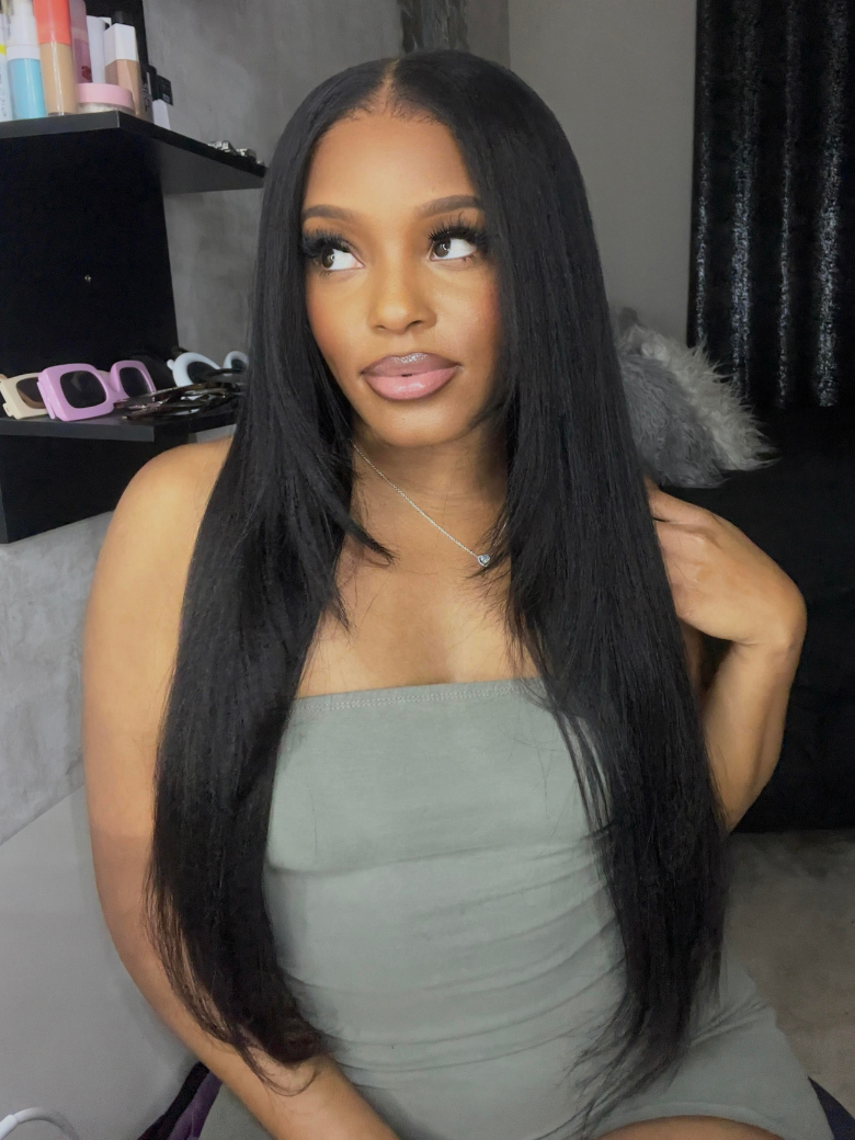 A model displays the UNice Yaki Hair Bundles 4 Pcs/pack Yaki Virgin Human Hair, showing a model with long black hair sitting on a bed and yaki texture, bundle fullness.