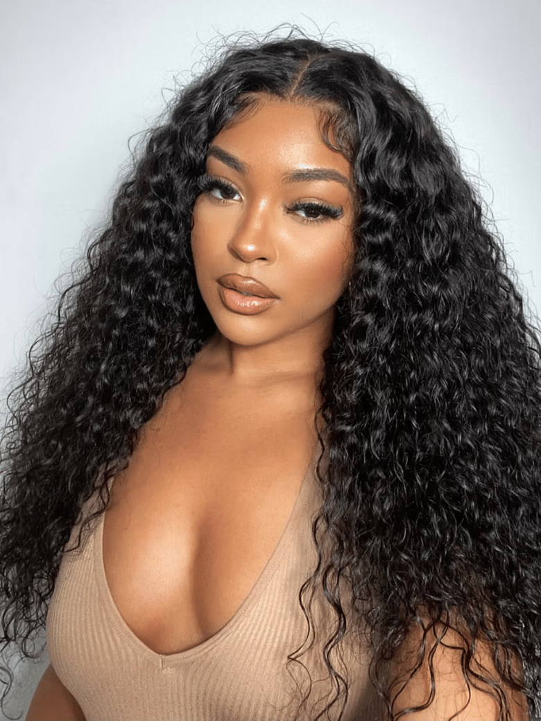 A model displays the UNice Ins Only 7x5 Drawstring Bye Bye Knots Wig Quick Glueless Wet & Wavy Water Wave, showing a model with long curly hair wearing a tan top.