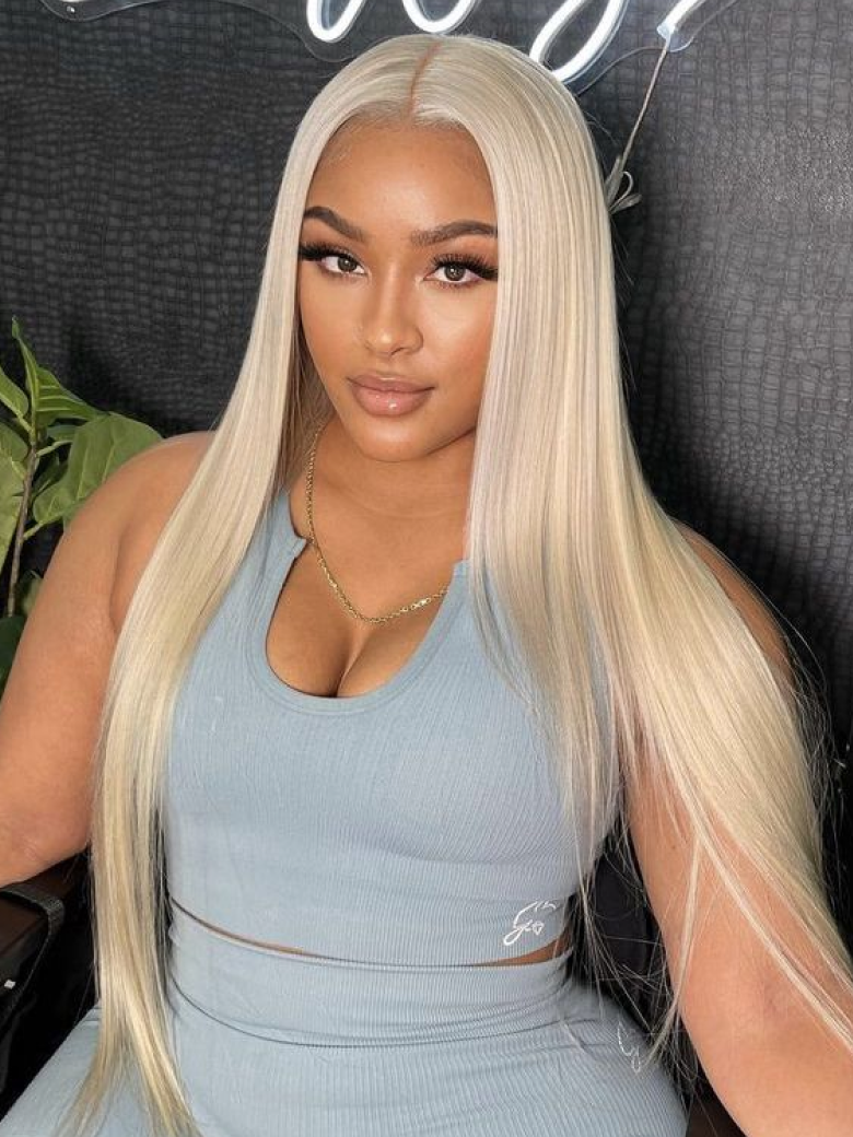 A model displays the UNice 180% High Density 13x4 Lace Front Straight Hair Wig Layered Butterfly Haircut, showing a model with long blonde hair wearing a blue dress.