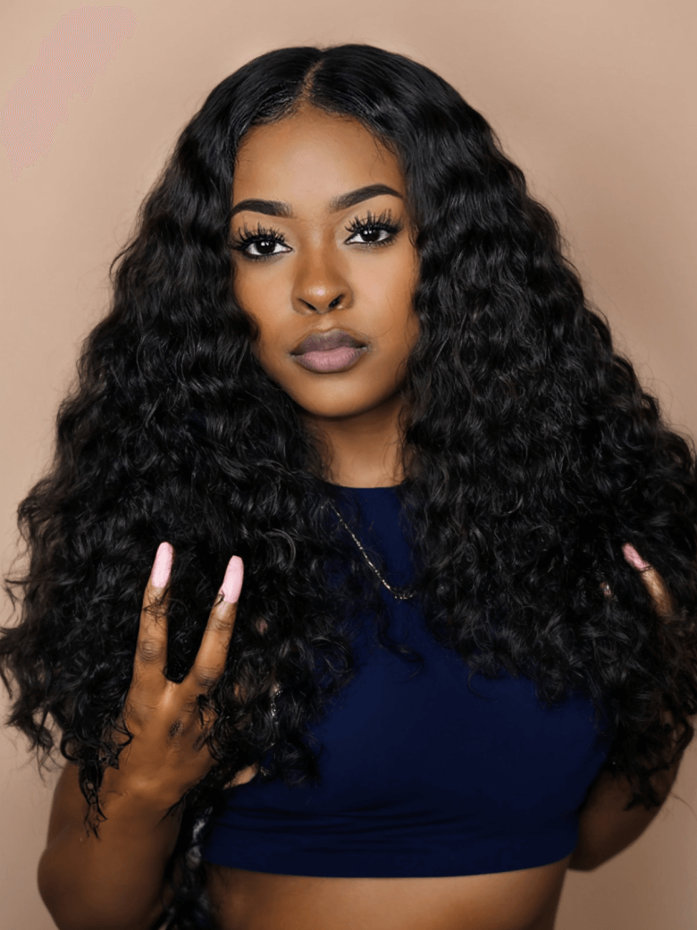 The Unice Invisible 5x5 HD Lace Closure Free Part Deep Wave Human Hair With Baby Hair visual image position 2 shows a model with long black hair and a blue top | deep.