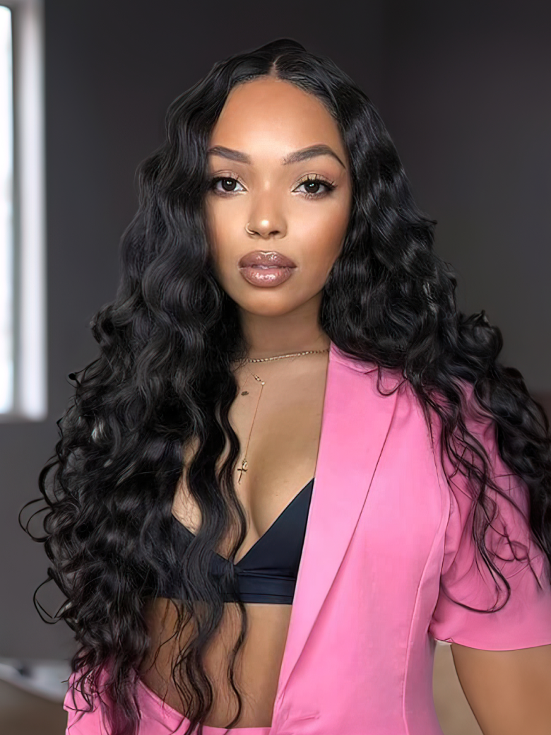 A model displays the UNice 5x5 Clear HD Lace Closure With Body Wave 3Pcs Bundles, showing a woman in a pink suit and black bra and body wave texture, 5x5, lace finish.