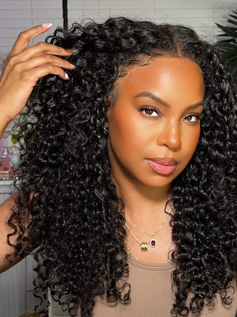 A model displays the UNice 7x5 Bye Bye Knots 150% Density Jerry Curly Wig With Bleached Invisible Knots, showing a model with long curly hair is straightening her hair.