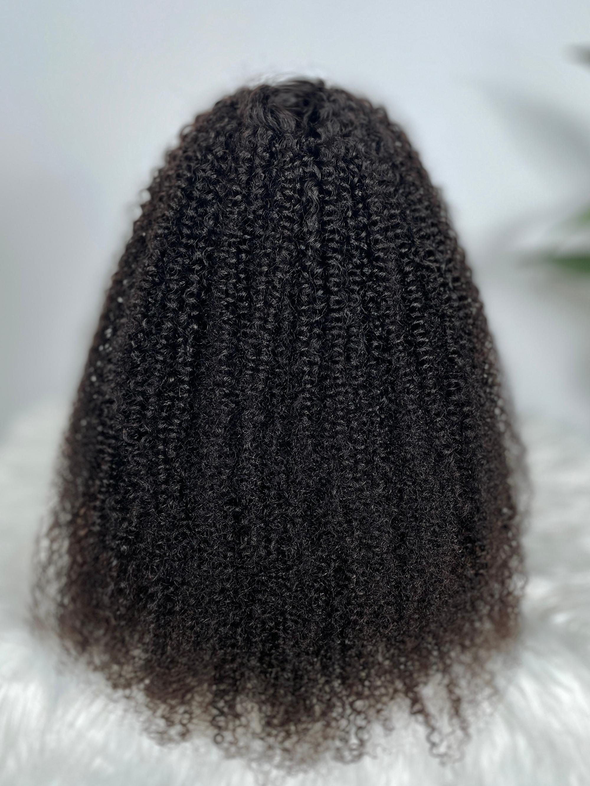 A model displays the UNice 200% Density HD Glueless 5x5 Lace Natural Afro Kinky Curly Human Hair Wig, showing a close up of a woman ' s long curly hair and kinky curly.