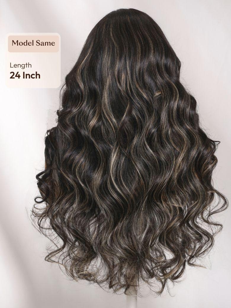 A model displays the UNice 7x5 Bye Bye Slip Lace Black With Blonde Face-Framing Highlights Body Wave Wig, showing a model with long wavy hair and a brown and black color.