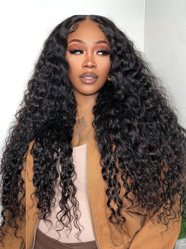 A model displays the UNice 7x5 Bye Bye Knots Lace Glueless Water Wave Grip Wig With Secure Silicone, showing a model with long curly hair wearing a brown jacket.