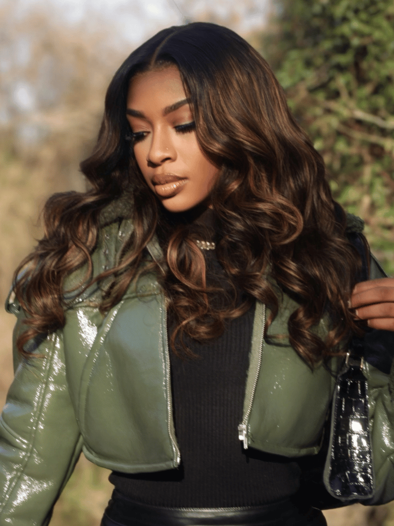 A model displays the UNice Brown Balayage 4x4 Lace Closure With 3Pcs Body Wave Bundles, showing a woman in a green jacket and black top and body wave texture, 4x4, lace.