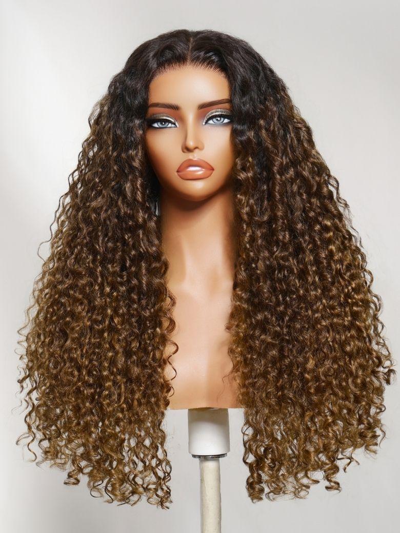 The UNice Bye Bye Slip 7x5 Lace Glueless Sun-Kissed Honey Brown Ombre Tight Spiral wig visual image position 4 shows a wig with long curly hair on a mann | ombre, 7x5.